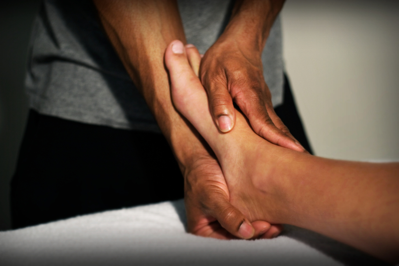 Ankle and foot treatment during a sports massage session